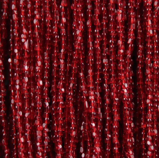 Close-up of strung Preciosa 9/0 three-cut glass seed beads in transparent ruby