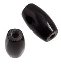 Two black 0.5 inch bone hairbone pipe beads showing the drilled centre hole
