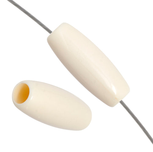 Two white acrylic hairbone pipe beads, one threaded on a wire to show the hole
