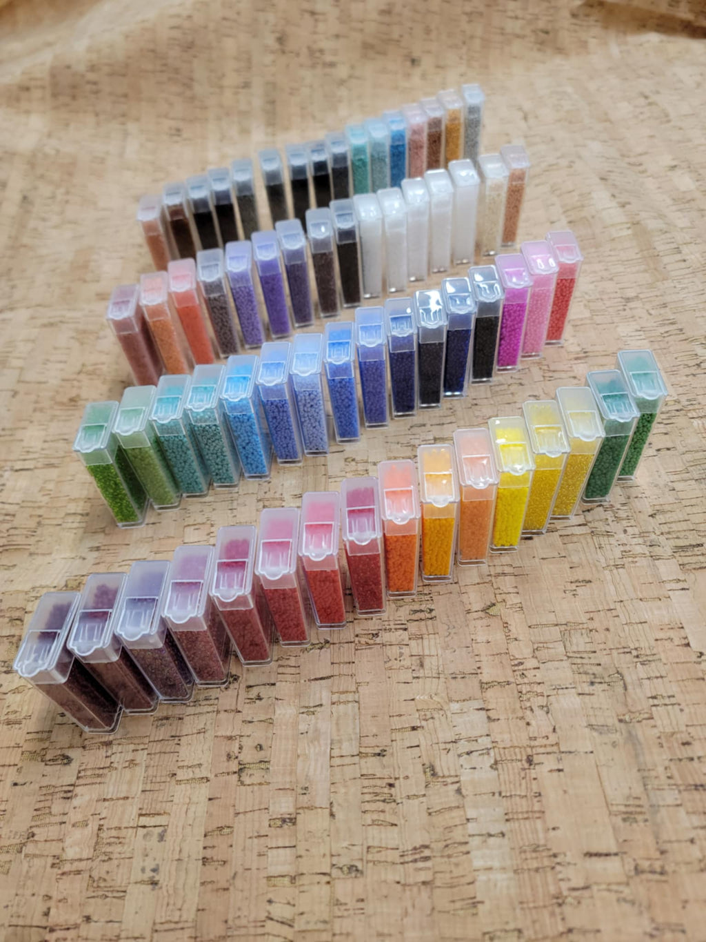 Four rows of filled bead tubes from the Preciosa variety box showing the full colour range
