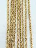 Hanging strands of 1.5 x 2mm gold stainless steel link chain