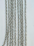 Hanging strands of 1.5 x 2mm rhodium stainless steel link chain