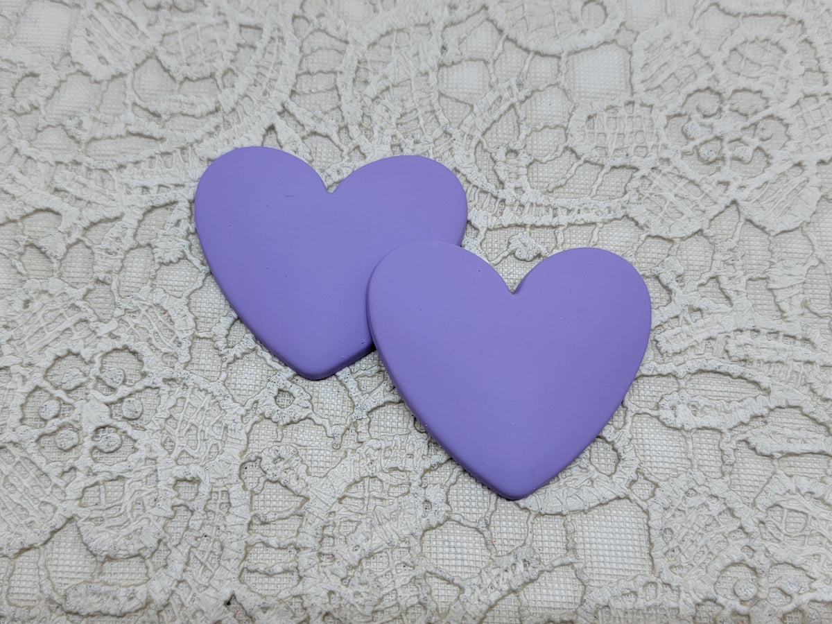 Pair of 37mm matte resin heart cabochons (cabs) in #10, shown as a light lavender purple
