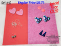 Set #10: pink and floral resin hearts, round cabs, ear wires, navy tassels and a spacer on pink sheets