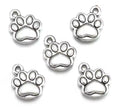 Four silver-tone 10 x 12mm paw print charms on a white background