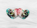 Pair of 37mm resin heart cabochons (cabs) with a Christmas fairy in a Santa hat on teal and red snowflake swirls