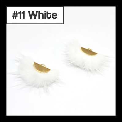 Pair of fan-shaped white faux mink tassels with gold-tone caps, labelled #11
