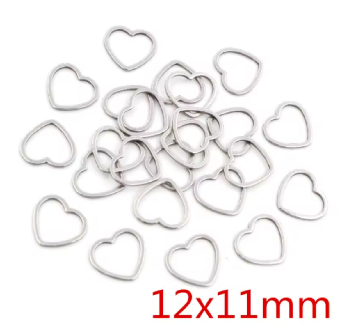 Pile of silver stainless steel open heart bezel frames, labelled 12 x 11mm