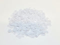 Pile of 6mm round white sequins with centre holes, on a white background