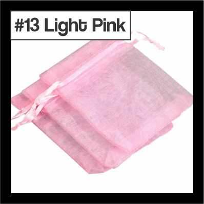 Sheer light pink organza drawstring bags with satin ties, with a numbered colour label