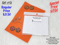 Set #13: two pairs of round floral cabs, blank epoxy stickers and rhinestone chain on an orange sheet
