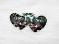 Pair of 37mm resin heart cabochons (cabs) with ravens and wrapped gifts in a snowy forest