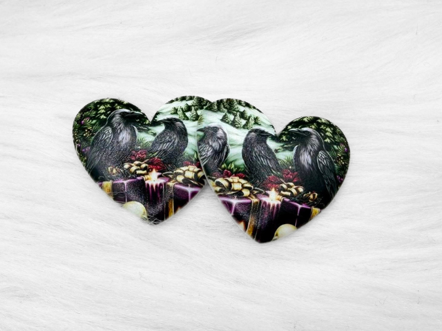 Pair of 37mm resin heart cabochons (cabs) with ravens and wrapped gifts in a snowy forest