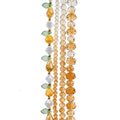 Four strands of Crystal Lane glass beads with flower, leaf and faceted round beads in a honey mix
