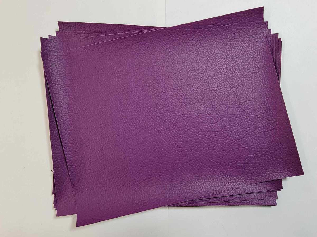Stack of #15 purple faux leather sheets with a pebbled grain texture