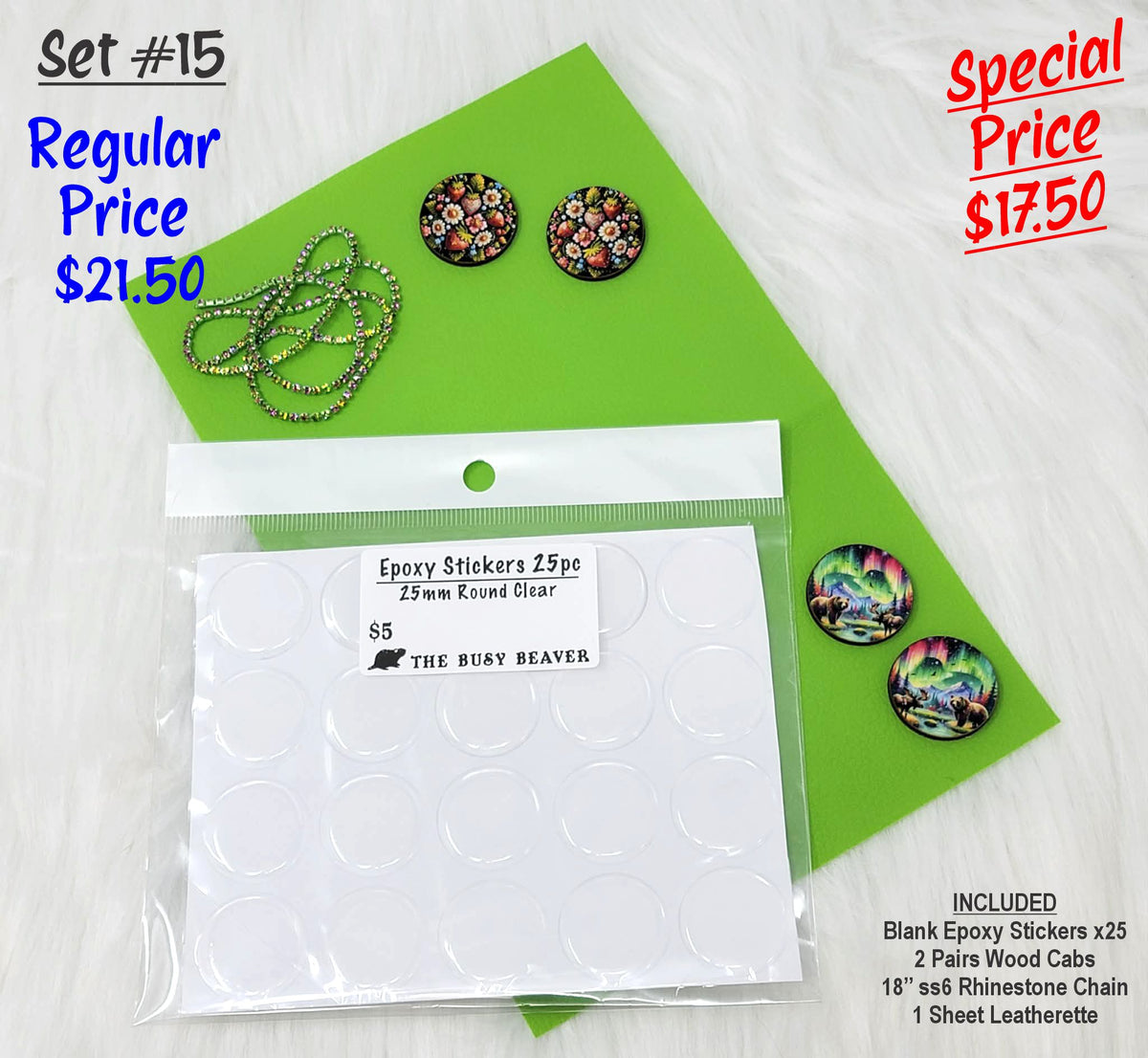 Set #15: two pairs of round floral and northern lights cabs, epoxy stickers and chain on a green sheet
