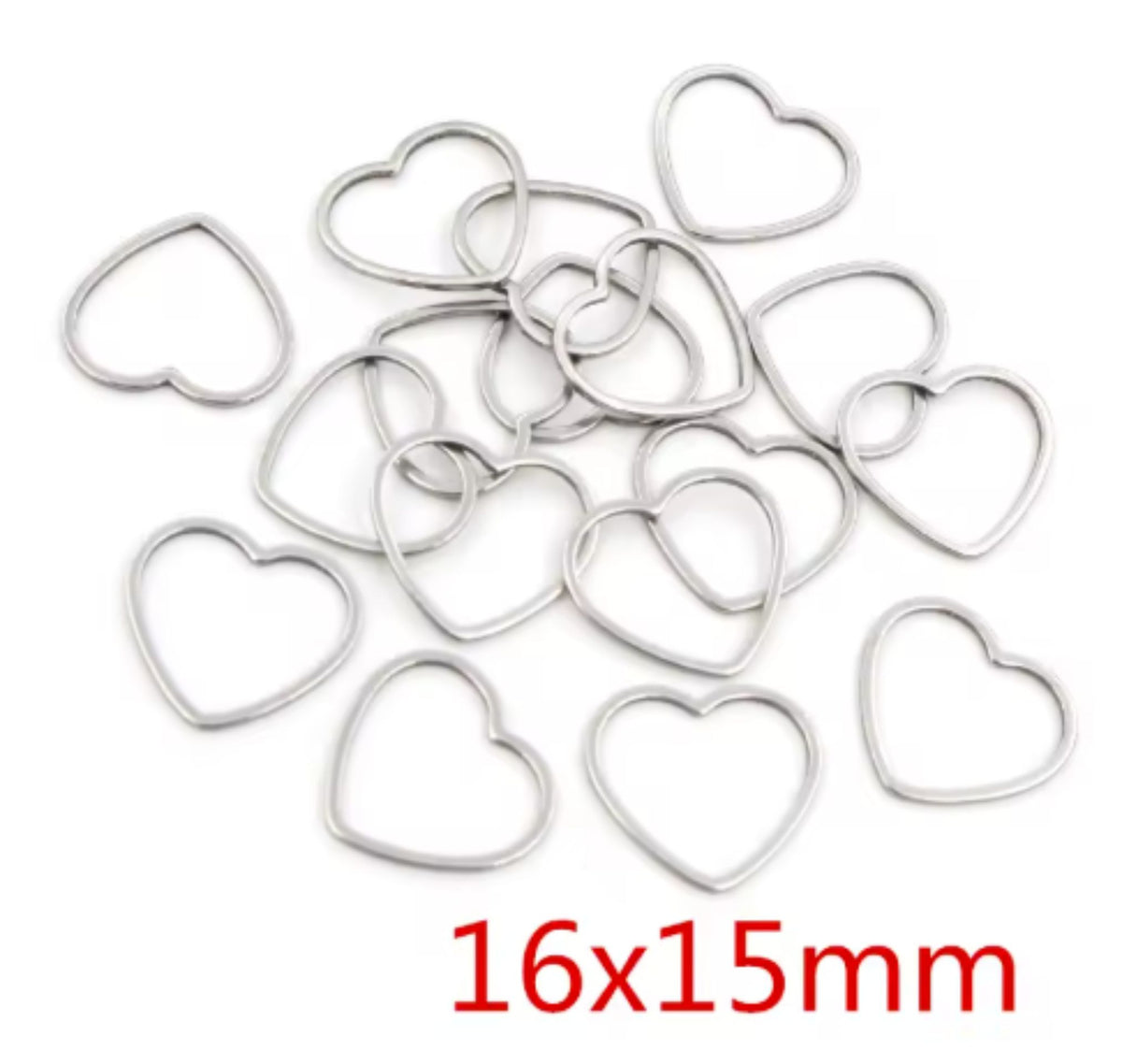 Pile of silver stainless steel open heart bezel frames, labelled 16 x 15mm