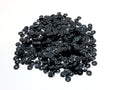 Pile of 6mm round black sequins with centre holes, on a white background