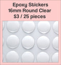 Sheet of 16mm round clear epoxy dome stickers with a pink label