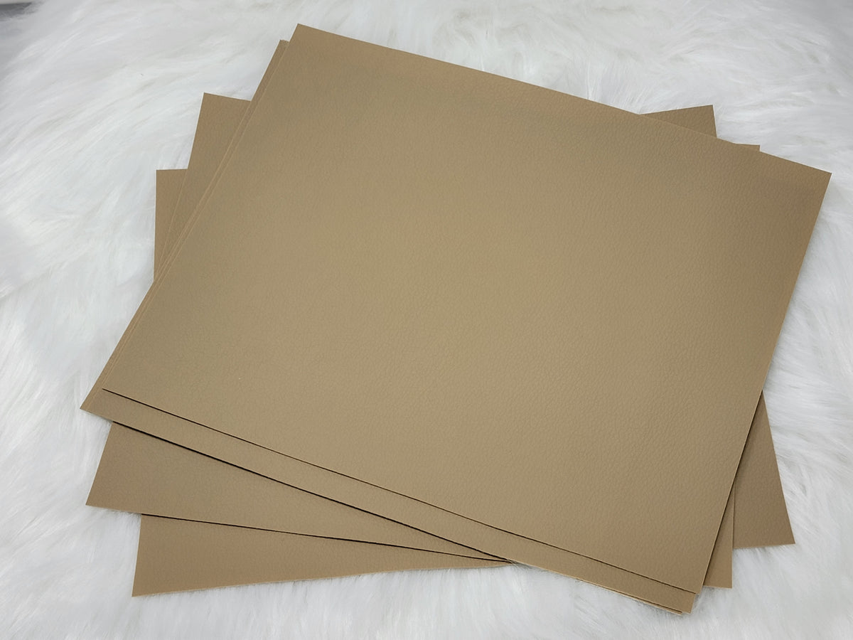 Stack of #17 tan faux leather sheets with a pebbled grain texture