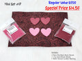 Mini set #17: red and pink resin hearts, pink and cranberry seed beads, and a brown tooled leather sheet