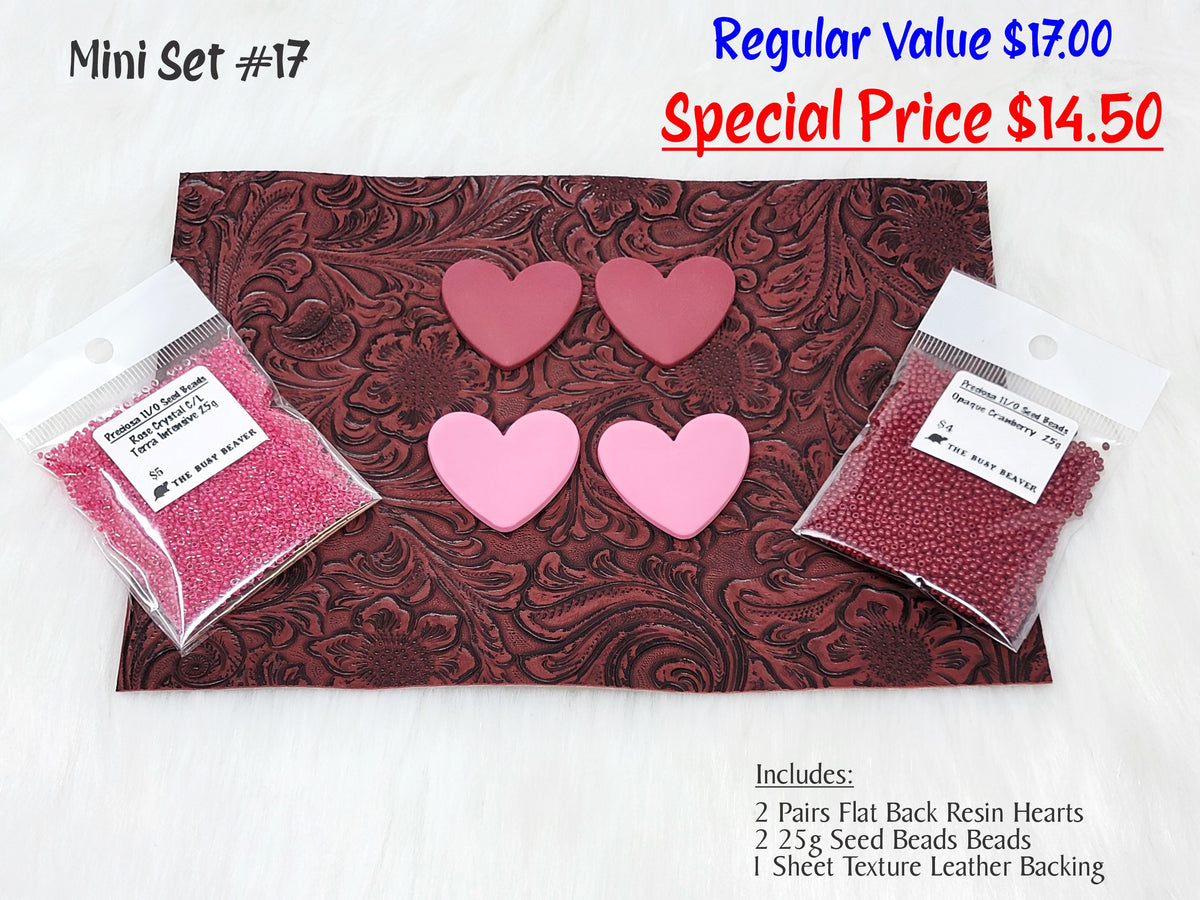 Mini set #17: red and pink resin hearts, pink and cranberry seed beads, and a brown tooled leather sheet