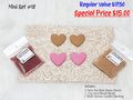 Mini set #18: tan and pink resin hearts, red and tan seed beads, and a cream tooled leather sheet