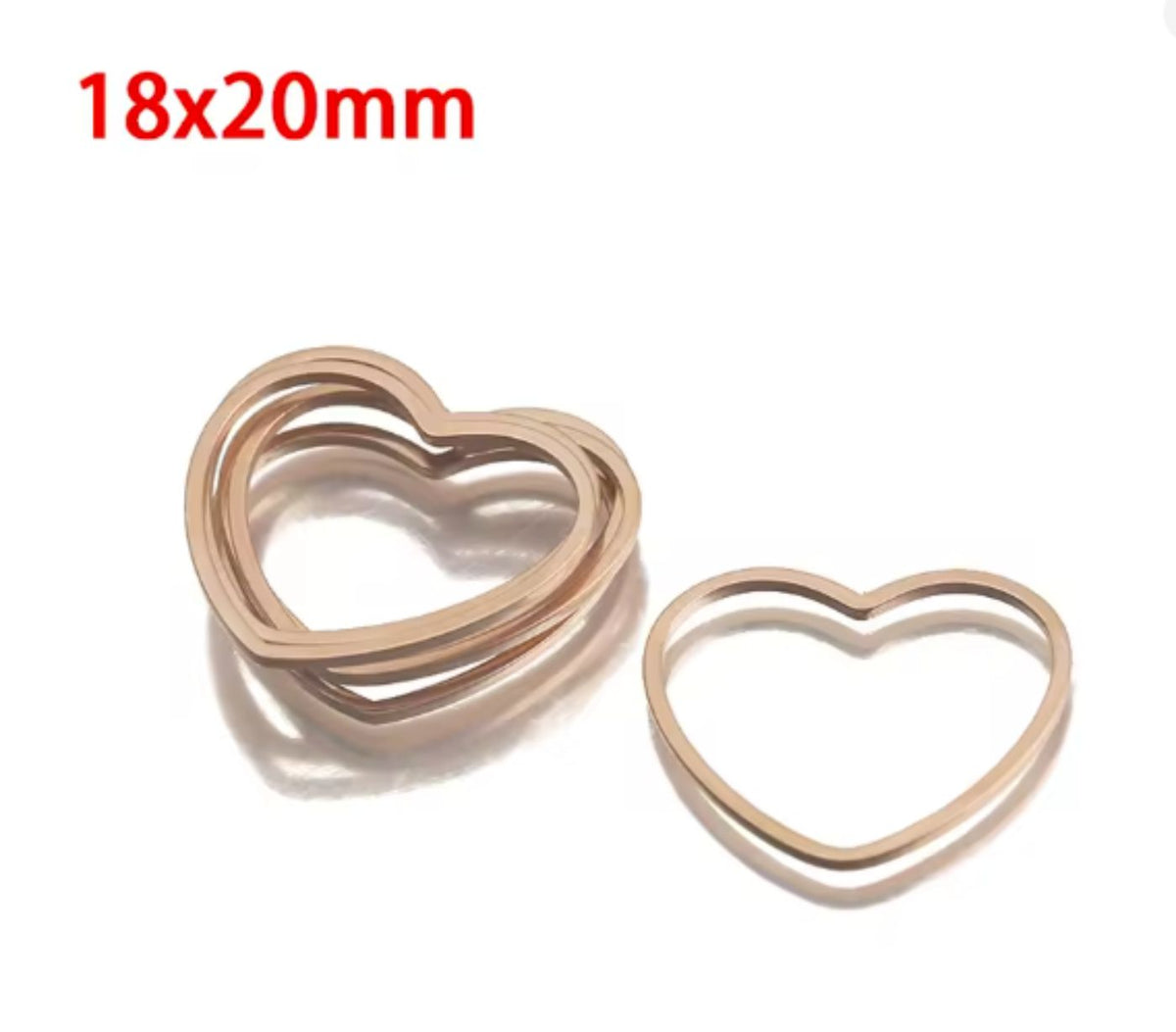 Pile of rose gold stainless steel open heart bezel frames, labelled 20 x 19mm
