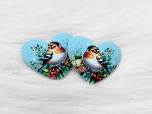 Pair of 37mm resin heart cabochons (cabs) in light blue with a robin on a holly branch