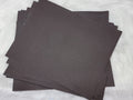 Stack of #19 dark brown faux leather sheets with a pebbled grain texture