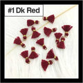 Scattered 1cm dark red cotton tassels with gold-tone rings on white fur, labelled #1