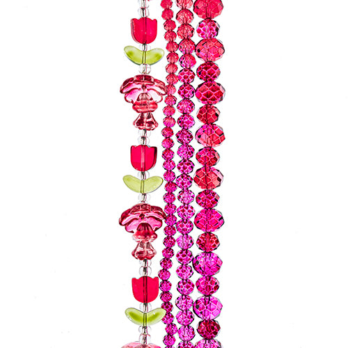 Four strands of Crystal Lane glass beads with flower, leaf and faceted round beads in a red to pink mix