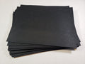 Stack of #1 black faux leather sheets with a pebbled grain texture