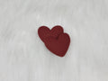 Pair of 37mm matte flexible PVC heart cabs in #1 Burgundy on white faux fur