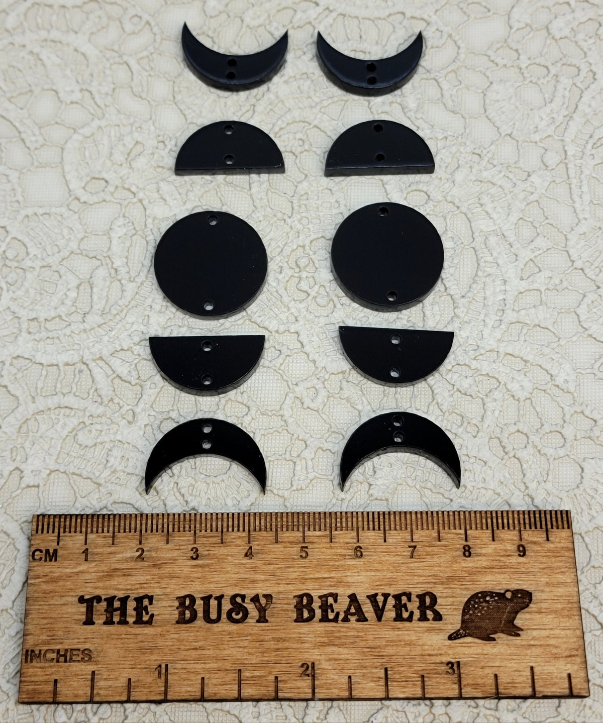 Two 5-tier acrylic moon phase sets in black: crescent, half and full moons beside a ruler