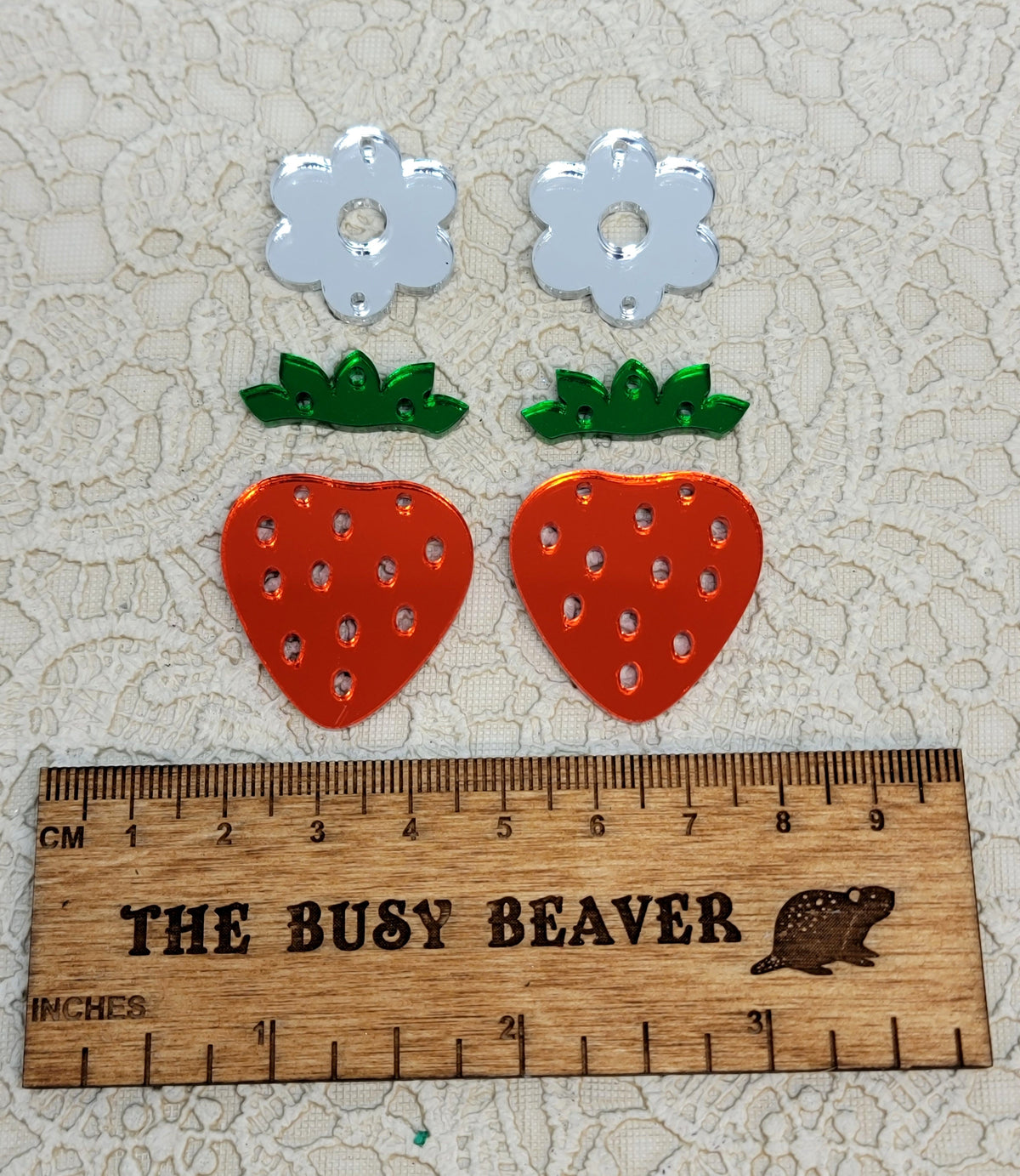 Two acrylic 3-tier strawberry sets: white flowers, green leaves and red strawberries, with a ruler