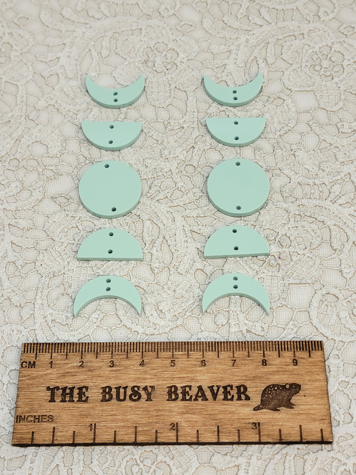 Two 5-tier acrylic moon phase sets in pastel sage: crescent, half and full moons beside a ruler