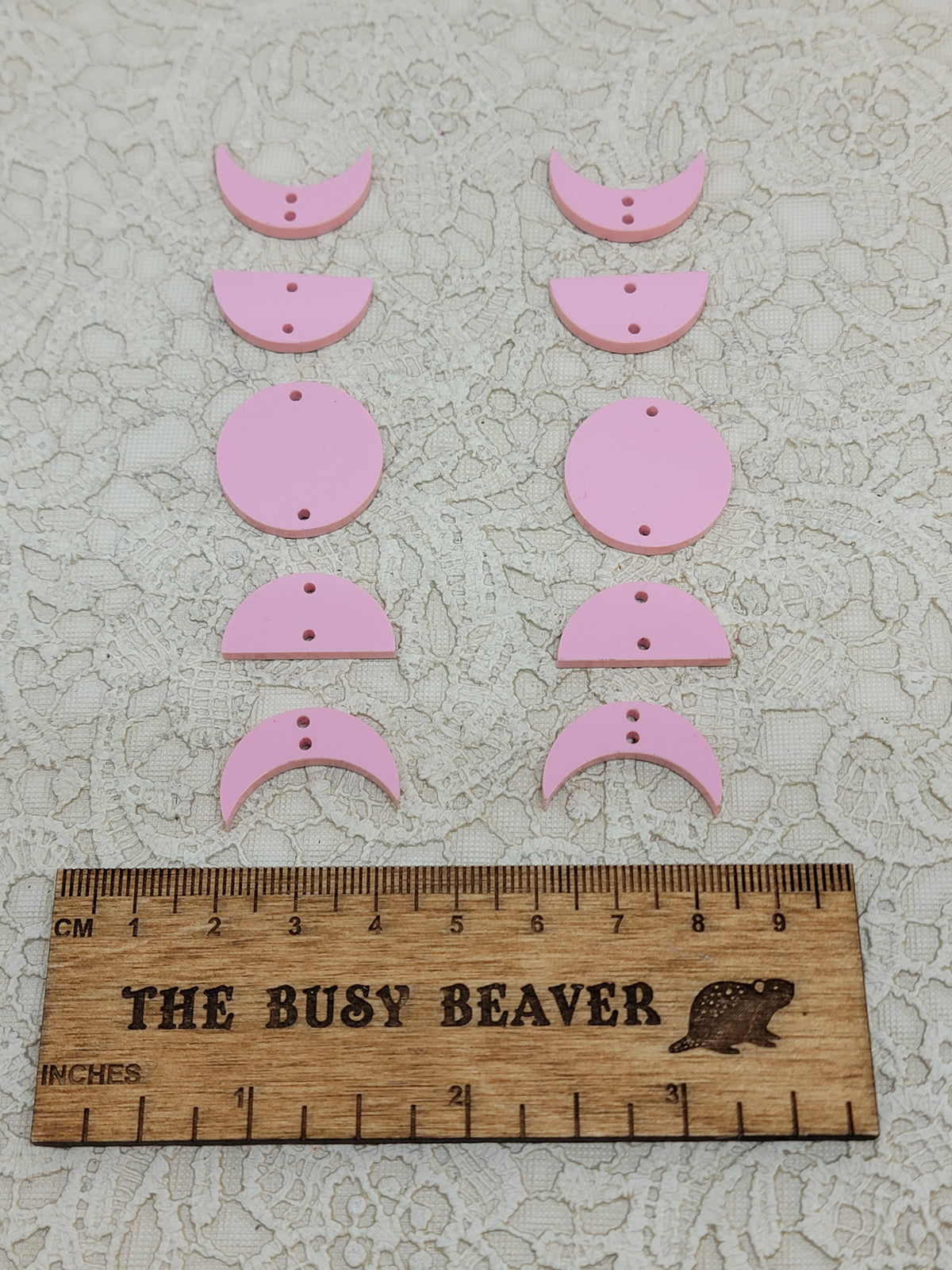 Two 5-tier acrylic moon phase sets in pastel pink: crescent, half and full moons beside a ruler