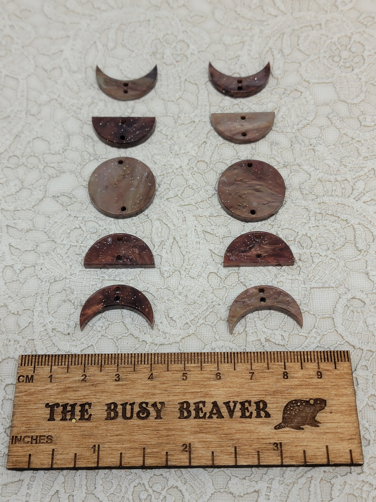 Two 5-tier acrylic moon phase sets in brown ripple: crescent, half and full moons beside a ruler