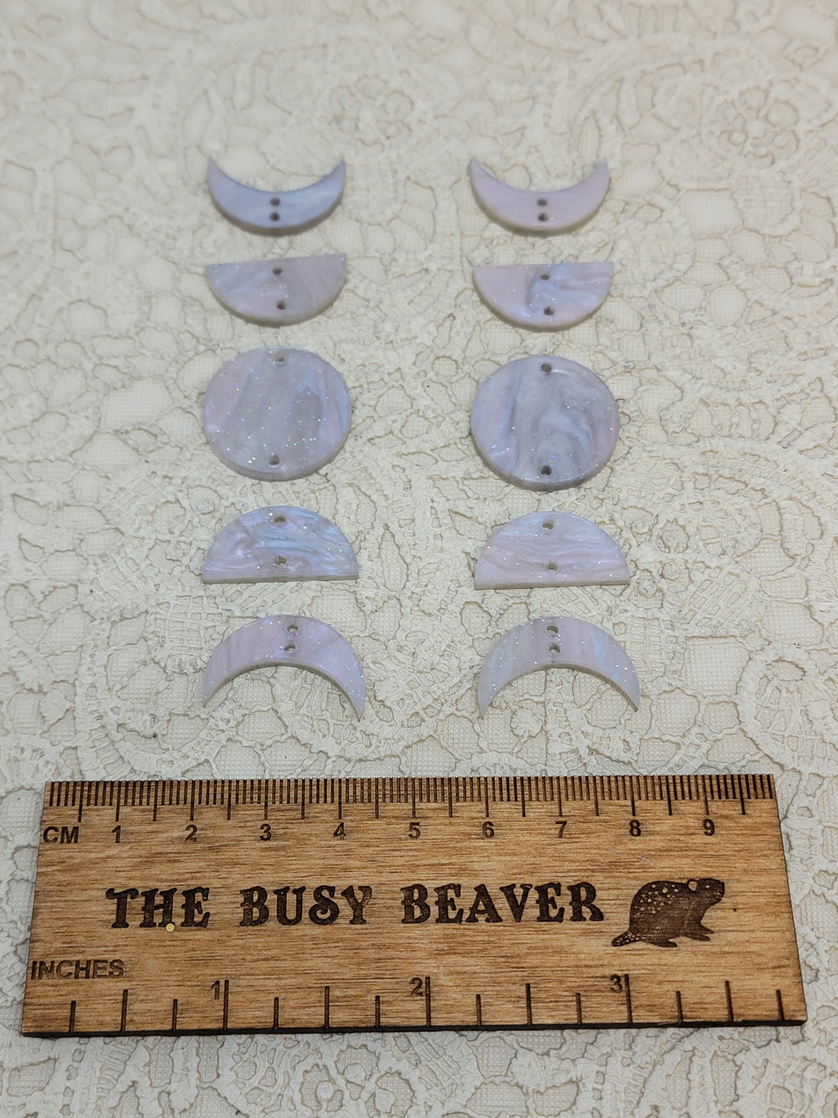 Two 5-tier acrylic moon phase sets in icy ripple: crescent, half and full moons beside a ruler