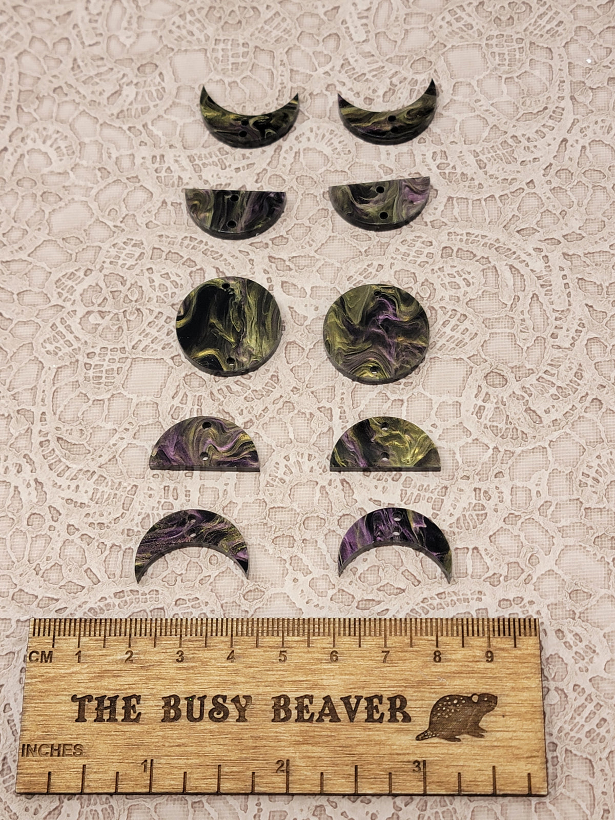 Two 5-tier acrylic moon phase sets in purple/gold marble: crescent, half and full moons beside a ruler