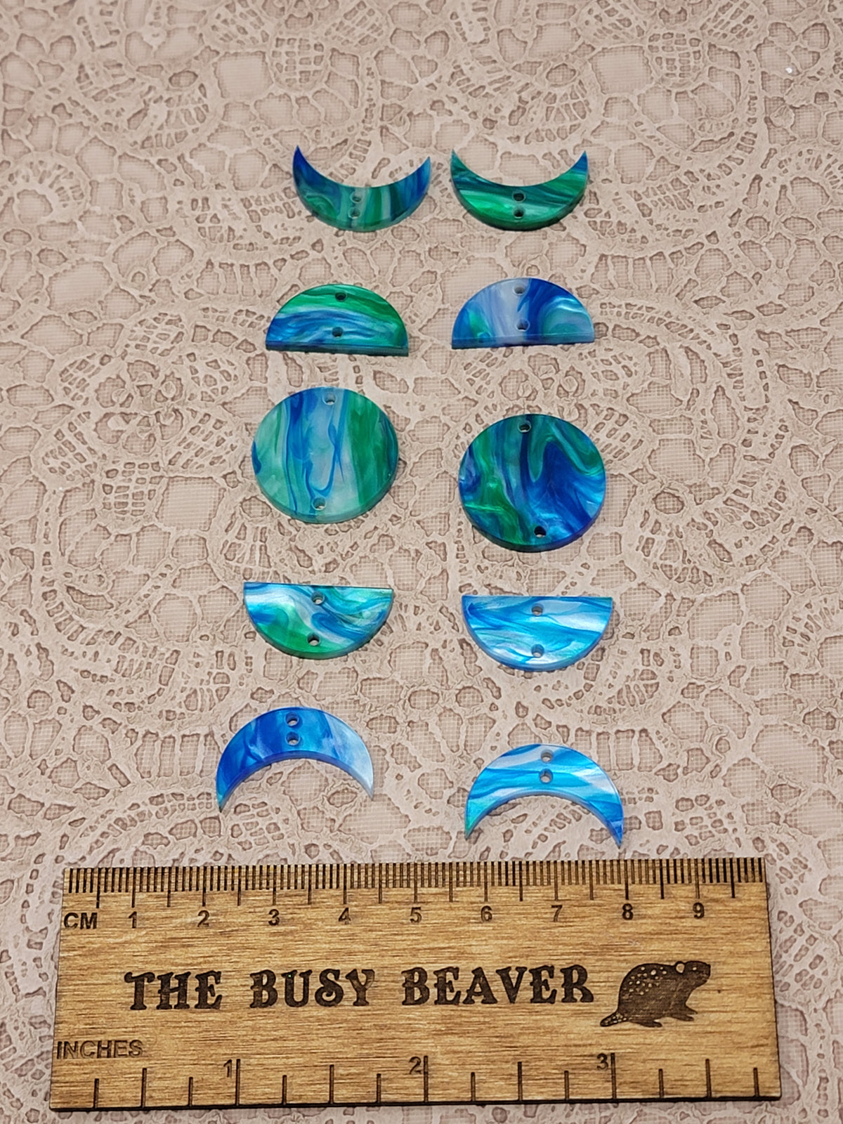 Two 5-tier acrylic moon phase sets in green/blue marble: crescent, half and full moons beside a ruler