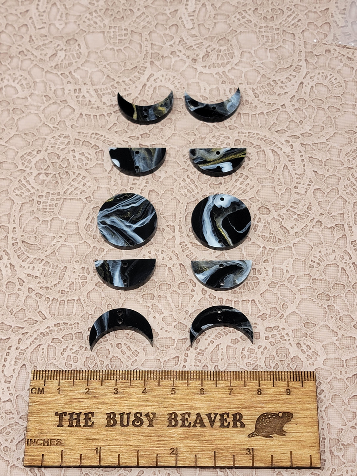 Two 5-tier acrylic moon phase sets in black/white/gold marble: crescent, half and full moons beside a ruler