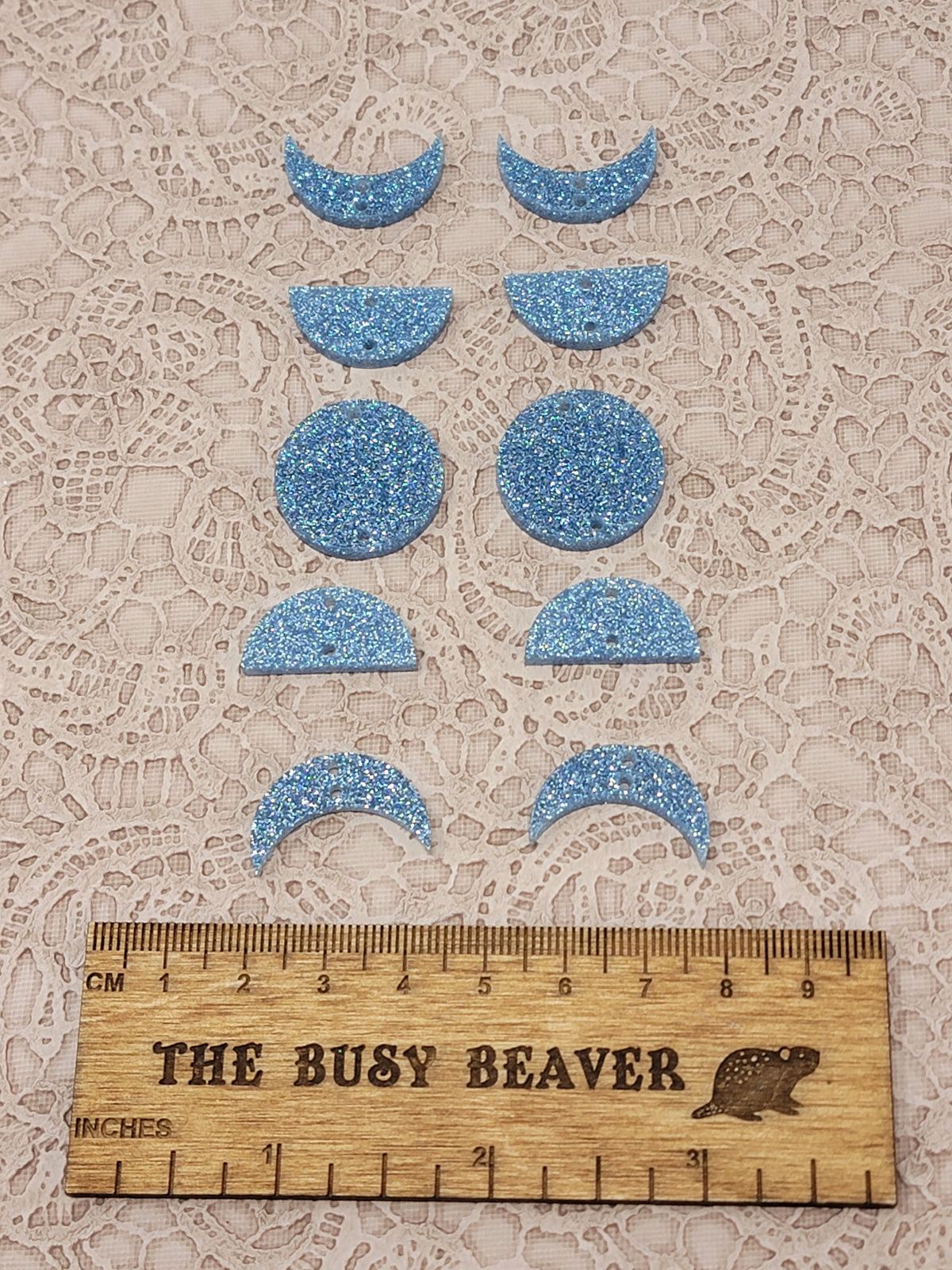 Two 5-tier acrylic moon phase sets in light blue sparkle: crescent, half and full moons beside a ruler