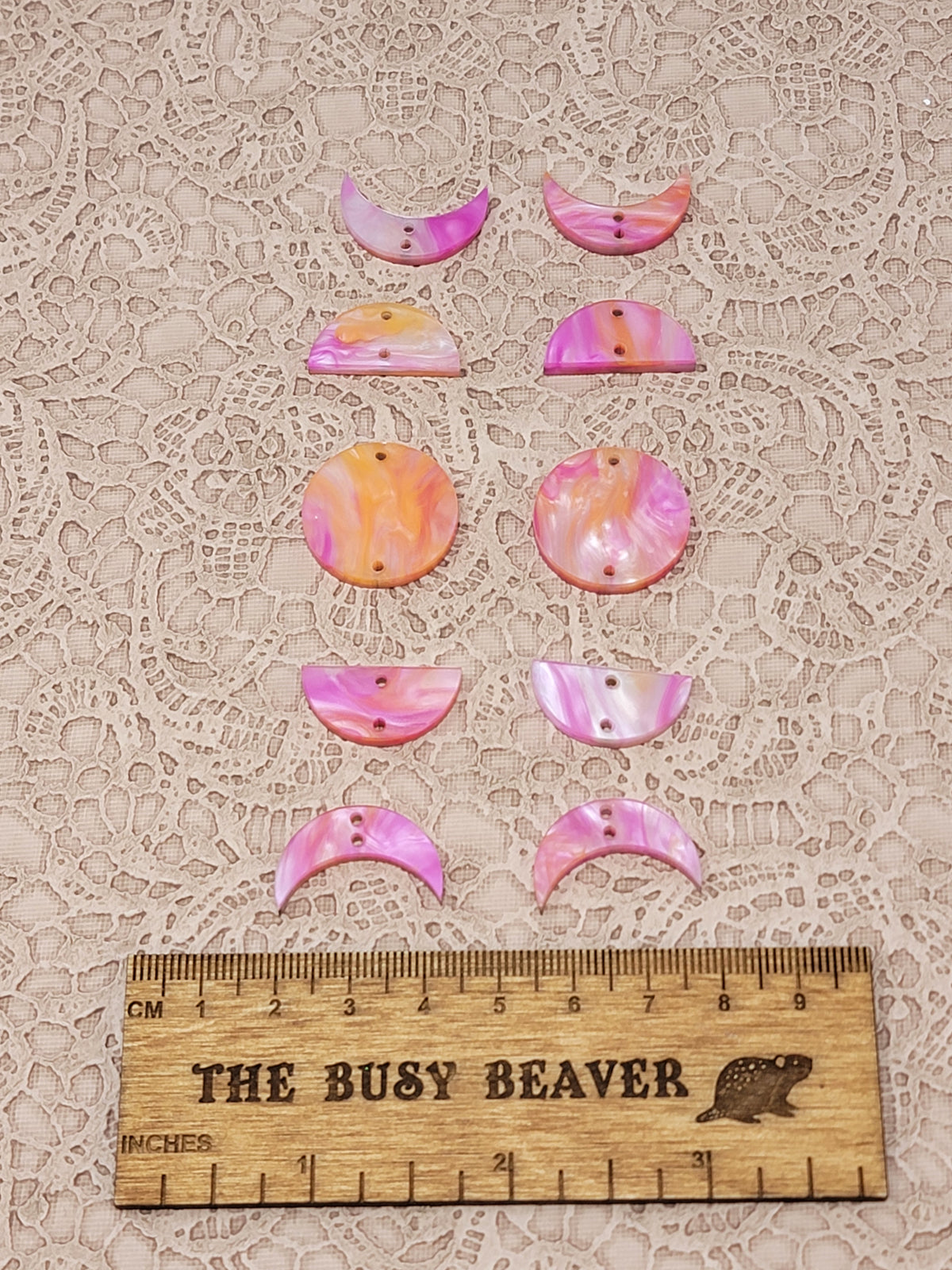 Two 5-tier acrylic moon phase sets in pink/orange marble: crescent, half and full moons beside a ruler