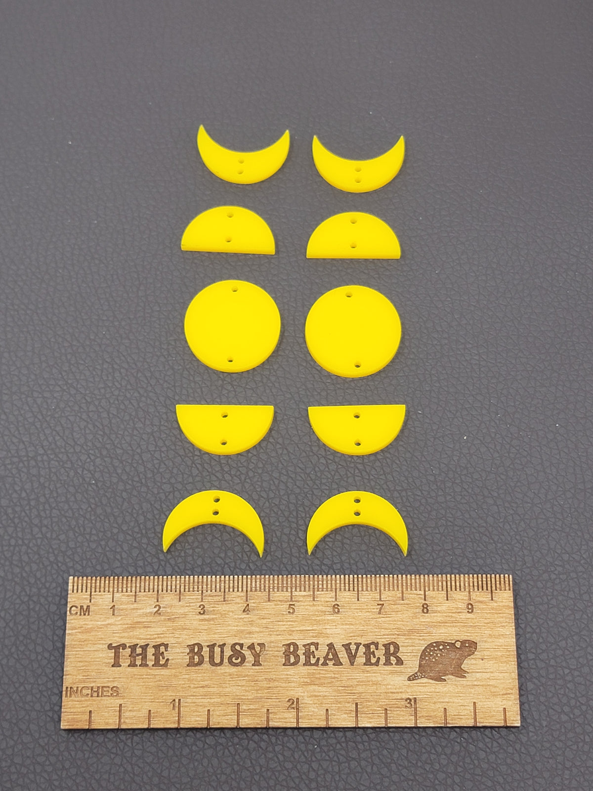 Two 5-tier acrylic moon phase sets in yellow: crescent, half and full moons beside a ruler