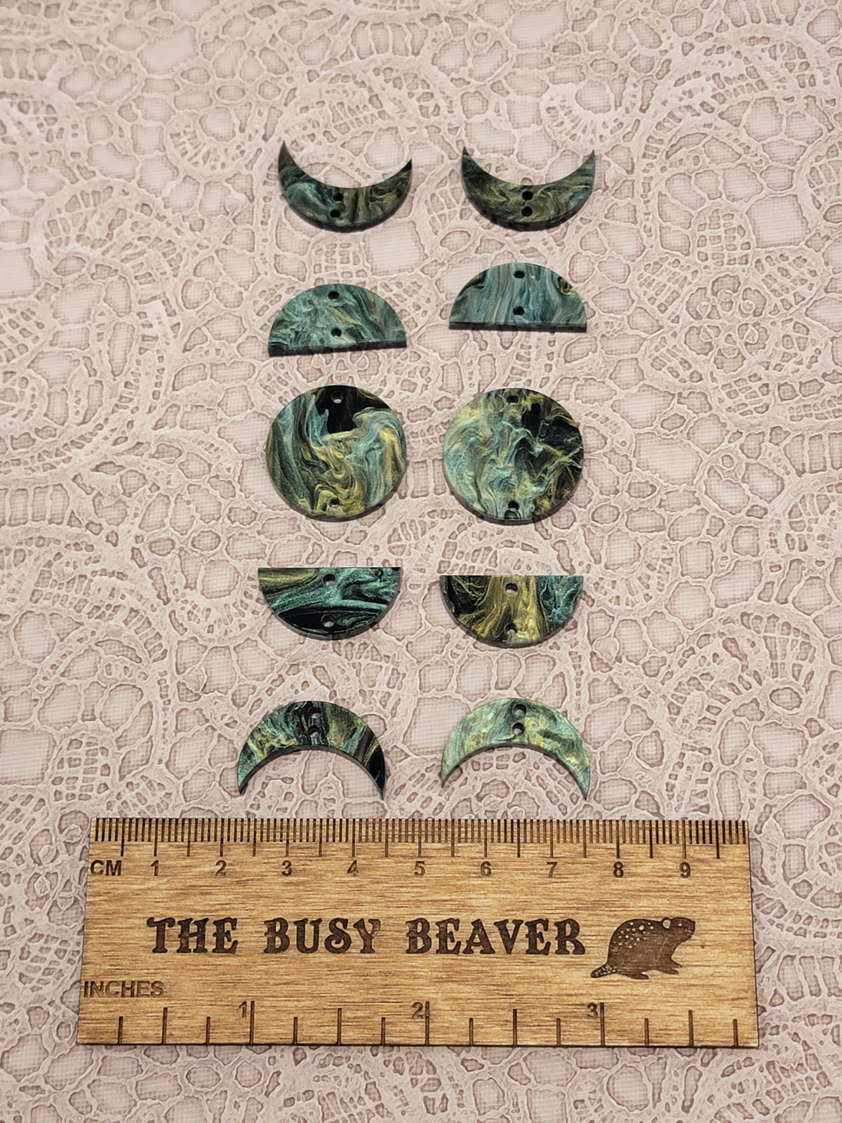 Two 5-tier acrylic moon phase sets in green/gold/black marble: crescent, half and full moons beside a ruler