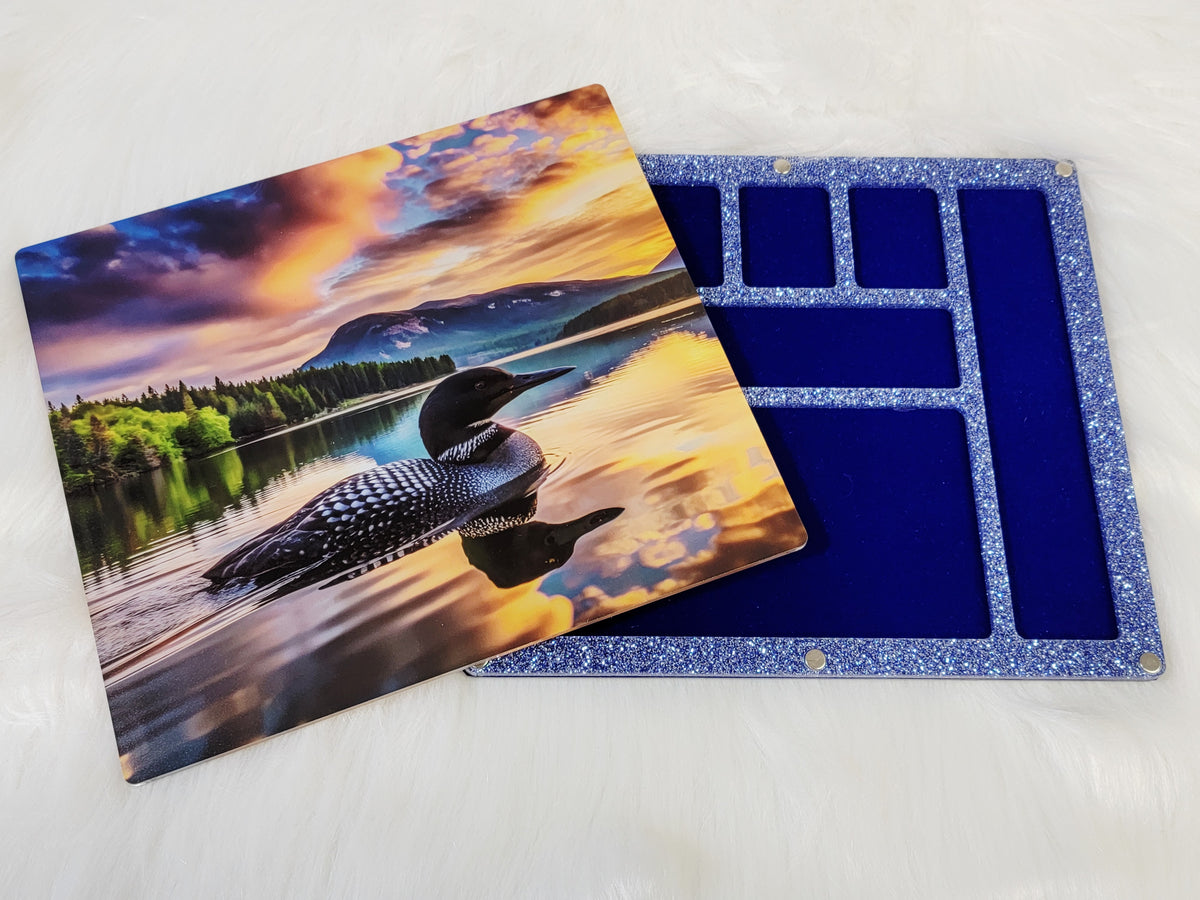 Same loon bead board in the Large 7 x 8 inch size with a blue glitter frame and navy velvet-flocked compartments