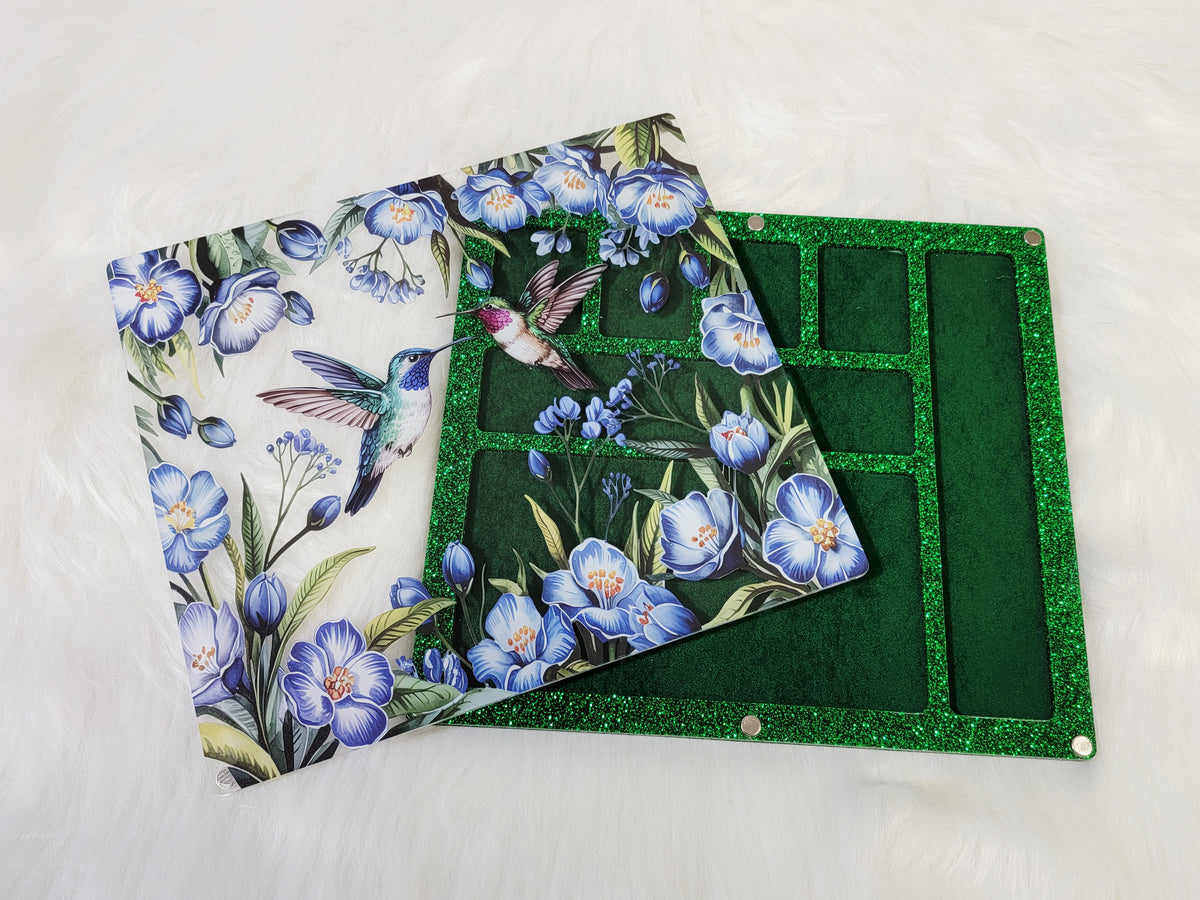 Large 7 x 8 inch magnetic-lid bead board with hummingbirds and blue flowers, lid beside its green velvet-flocked tray