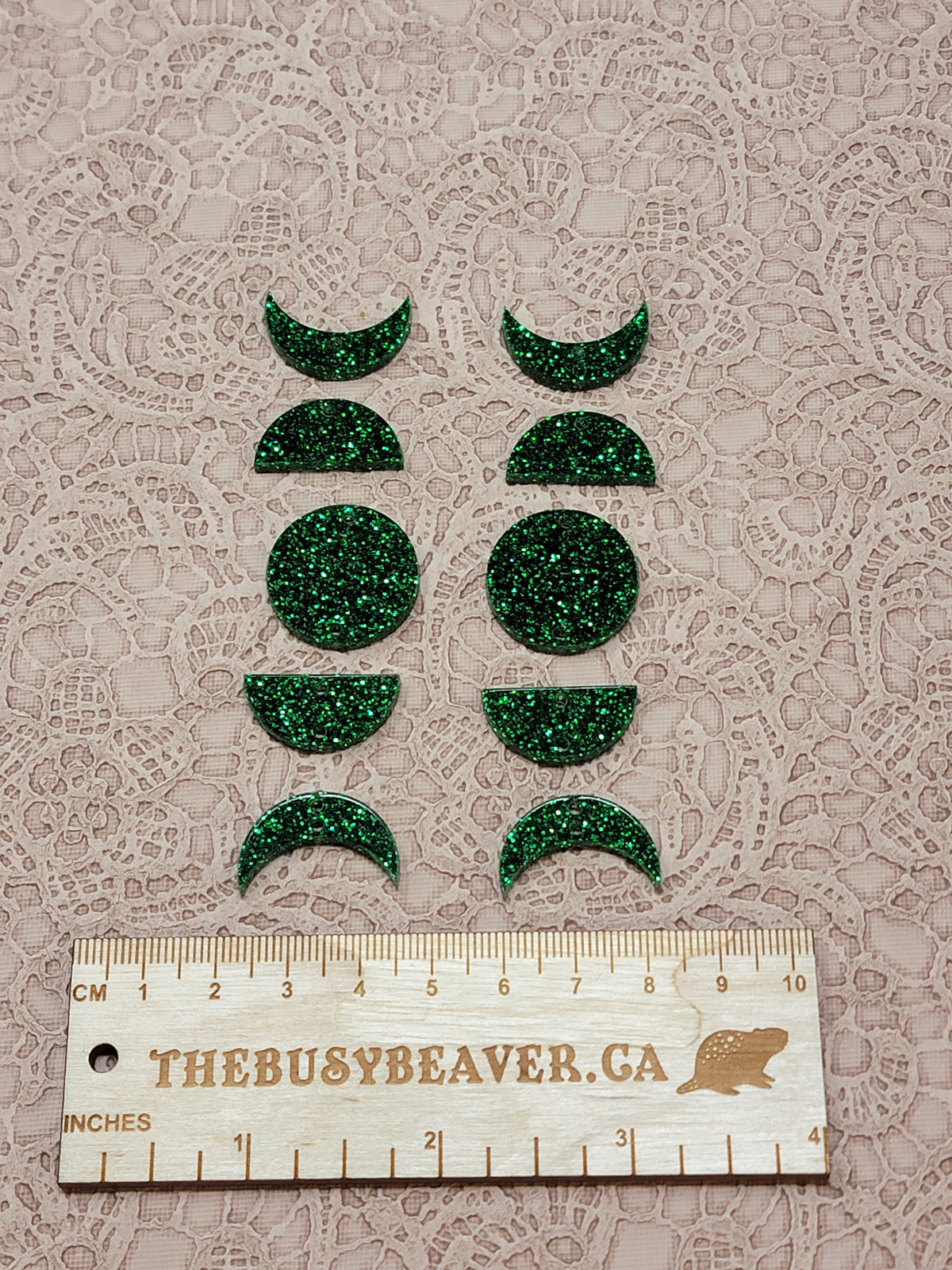 Two 5-tier acrylic moon phase sets in green glitter: crescent, half and full moons beside a ruler